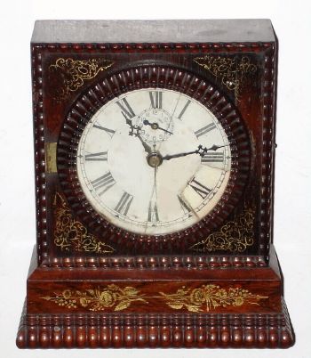 Ripple molding rosewood veneered clock case. This case probably had a small lever timepiece movement by Forestville/ J.C. Brown, but now with a battery movement and hands. C.1850. — Antique Clocks Price Guide