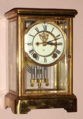 Ansonia Clock Co., PRISM, 4-glass crystal regulator, with open escapement dial, 8-day, time and gong strike, spring, C.1915. — Antique Clocks Price Guide