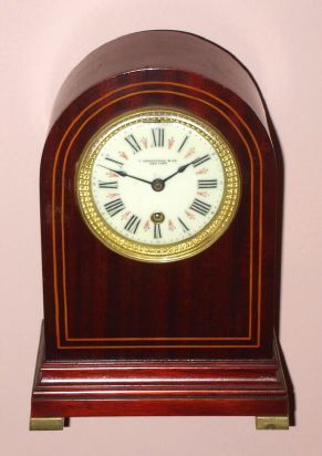 Chelsea Clock Co., for T. Kirkpatrick and Co., New York, Round Gothic mahogany timepiece, serial No. 102438, C.1915 — Antique Clocks Price Guide