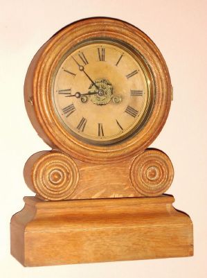 E. Ingraham and Co., GRECIAN, Round top mantle clock, 30 hour time, strike and alarm in oak, C.1880 — Antique Clocks Price Guide