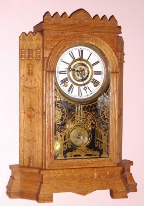 Wm. L. Gilbert Clock Co., "ALTAI", 8-day time and cathedral gong strike, bell alarm mantel clock. This is a later version with some design changes produced in Oak. Circa 1895. — Antique Clocks Price Guide