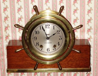 Seth Thomas Clock Co., "Mayflower - 1940", 8-day lever movement time and ship's bell strike mantel clock, cast brass tub w/ hinged bezel, base with brass trim. Circa 1940 — Antique Clocks Price Guide