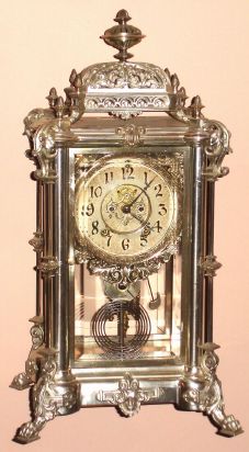Ansonia Clock Co, large 4-glass, EXCELSIOR, in nickel / silver finish, now with a pendulum from a French clock,C.1904 — Antique Clocks Price Guide