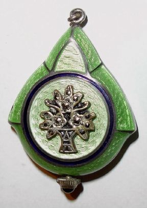 Swiss Pendant watch, green guilloche enamel, and the reverse with 11 faceted pastes in a silver tree, with a closely matching silver chain with green accents. Sapphire Cabuchon crown. — Antique Clocks Price Guide