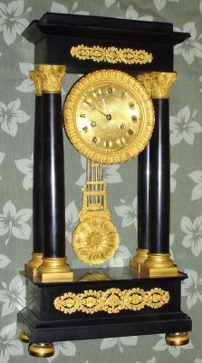 French, Empire style portico clock of black marble with finely chased ormolu trim and fancy grid pendulum, large movement (30-day ?) Retailed by a dealer in "New Yorck" C.1860 — Antique Clocks Price Guide