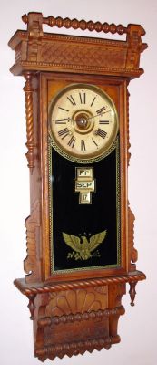 Wm. L. Gilbert Clock Co., "Sharon", 8-day time/strike McCabe patent calendar wall clock. Circa 1901 — Antique Clocks Price Guide