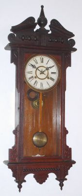 Waterbury Clock Co., "Eton", 8-day time/strike wall clock. Circa 1906 — Antique Clocks Price Guide