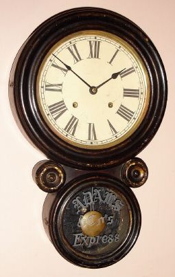 E. Ingraham and Co., "Ionic", 8-day time/strike advertising wall clock, for Adams and Co., Express, Circa 1911 — Antique Clocks Price Guide