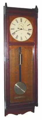 Seth Thomas, "REGULATOR No. 17", from the Searsport, Maine station of the Bangor and Aroostook Railroad Company, not labeled, but includes an old typewritten message on an empty car way-bill. Uses the large trapezoid movement No. 62. C.1884. — Antique Clocks Price Guide