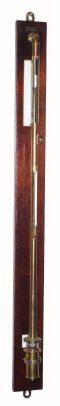 American Lab Barometer, Central Scientific Co., Chicago, IL, a typical brass protective tube surrounding the glass tube, and with F/C glass tube thermometer on the side, the whole on a wall hanging mahogany mount with white stone-like reflective strips to make it easier to see the mercury. C.1935 — Antique Clocks Price Guide