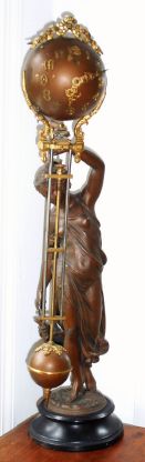 Ansonia Clock Co., New York, "HUNTRESS" swinging arm clock, a short pivoted pendulum in the ball above stays generally vertical while the suspended ball and arm swing from side to side. C.1894 — Antique Clocks Price Guide