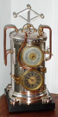 French, Steam Boiler automaton from Guilmet's industrial series, a cylindrical boiler with riveted top, surmounted by a rotating "governor", powered by a separate movement, wound from the rear. Timepiece movement, sets in "fire-box", and is wound from the front, and with a barometer above. C.1885 — Antique Clocks Price Guide