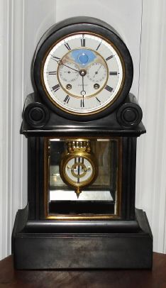 French, Black marble mantel clock with day and date calendar plus moon-phases on the dial, pat A. Brocot and Dellettrez, signed on movement and dial below 6, C.1890 — Antique Clocks Price Guide
