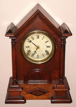 Waterbury Clock Co, "BLACK WALNUT EXTRA GOTHIC PILLAR" (the actual catalog name), 8-day time and strike mantel clock, C.1857 — Antique Clocks Price Guide