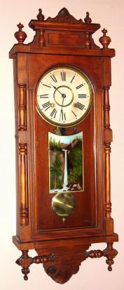 Ansonia Clock Co., "Queen Elizabeth", Victorian mahogany cased wall clock, 8-day time and gong strike wall clock. Circa 1901 — Antique Clocks Price Guide