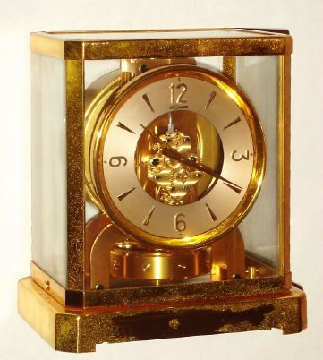 Swiss, LeCoultre, ATMOS, 15j., self winding perpetual running timepiece in a brass and glass case, serial no. 59555, C.1955. — Antique Clocks Price Guide