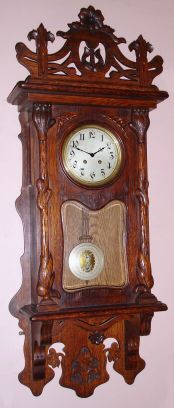 German, Oak Cased, Art Nouveau wall clock with nice rack strike, 8-day movement marked B and W, serial 60104, C.1920 — Antique Clocks Price Guide
