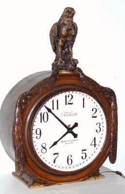 Warren Telechron Co, Ashland, Mass, a large mahogany cased 110v timepiece with cord, the case trim cut out to accept a plastic and plaster eagle on top, 16" dial C.1935 — Antique Clocks Price Guide