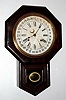 Ansonia Clock Co., short drop octagon, time and gong strike school clock with calendar, rosewood veneer. C. 1900.