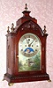 English, 2-Fusee, Bell Strike bracket clock, with painted arched dial, Halifax moon above 6 and with calendar aperture below 12, mahogany case with flame finials and brass side frets. C. 1860.