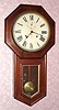 Seth Thomas Clock Co., WORLD model, 15-day long drop octagon timepiece in walnut. C. 1920.