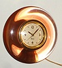 Chelsea Clock Co. "ELECRONOMETER", Model "VE", 110v electric, corded timepiece, in peach lucite case. C. 1950.