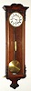 Austrian, late Biedermeier timepiece, 30-day 1-weight, maintaining power, in a rosewood case with dark gesso accents, less top trim. C. 1855.