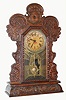 E. Ingraham GILA, Time, strike and calendar pressed oak gingerbread clock, 8-day. C.1910.