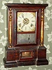Atkins Clock Co., Bristol, Conn, LONDON model rosewood shelf clock, time, strike and alarm, 8-day spring. C.1863.