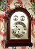 German, Westminster Chime bracket clock, in a mahogany case with canted, reeded corners, and with silvered arched dial with subsidiary dials for F/S and Chime/Silent, 8-day. C.1920.