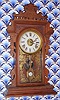 E. N. Welch Mfg. Co, "ERMINE", walnut gingerbread clock, time, gong strike and bell alarm, 8-day. C.1884.