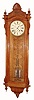 Seth Thomas Clock Co., "REGULATOR No. 19", in oak, with 12" painted dial, center seconds, 2-jar compensating pendulum, weight driven, 8-day. C.1890.