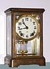 Ansonia Clock Co, 4 glass Crystal Regulator, plain corniche case, with solid porcelain dial, 8-day time and gong strike. C.1910.