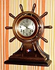 Chelsea Clock Co, Ship's Bell "YACHT WHEEL" model with 4 1/2" SPECIAL dial ( raised numerals), Model L movt, presentation piece contract for Black, Starr and Frost (on dial). Engraved along outer brass wheel "TO A GOOD SHIPMATE" + "F.C.E TO L.P.F" with fine multicolor enamel flag decorating base, spring driven, 8-day. C. 1926.