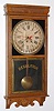 E. Ingraham and Co, Bristol Conn, "WESTERN UNION" calendar model, 8 day time brass mvt store regulator in solid oak case with 12" dial, spring driven. C. 1907.