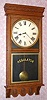 E. Ingraham and Co, Bristol Conn, "NORTHWESTERN" model, 8 day time only brass mvt store regulator in solid oak case with 12" dial, spring driven. C. 1910.