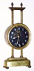 French, brass cased gravity clock, one day, with glass dial showing compound pendulum. C.1920.