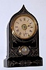 Terry Clock Co., Waterbury, Conn, iron cased alarm clock, 8-day time and bell strike. C.1860.