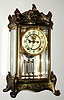 Jennings Brothers, Chicago, IL, (made by Ansonia for Jennings retail establishment), 4-glass crystal regulator, 8-day gong strike with open escapement. C.1910.