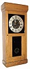 Gisholt Machine Co., Madison, WI, PERIODOGRAPH, a weight driven programmable contact maker, with an E. Howard No. 70 movement and pendulum to power the program discs, in an oak case with black/gold tablet in the front door. C.1919.