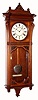 Seth Thomas "MARCY" in walnut, striking the quarter hours on 2 cupped bells and the hours on a cathedral gong, with nickeled bezel and damascene pendulum. C.1890.