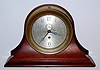 Chelsea Clock Co., Engine Room timepiece with 6 inch dial in a yellow brass case with screw bezel, serial No. 179165. With a C. 1980 Chesea factory desk stand, mahogany. C.1927.
