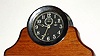 Chelsea Clock Co., Engine Room timepiece, with 4.5" Black Dial, serial No. 120602, in a nickel finish brass case with screw bezel, on a later oak stand. C.1917.