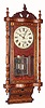 Anglo American inlaid wall clock, rolling pin bottom, and English case with imported New Haven movement, 8-day spring. Clock makers in the British midlands took advantage of the $1 American movements that worked well in their attractive cases. An English movement would have cost them over ten times as much. C.1875.