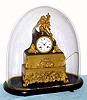 French, bronze and fire gilt figural mantel clock, 8-day time and bell strike, Young Explorer with Flag, and with cracked dome that Len had over it to keep it clean. C.1850.