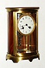 French, Japy Freres, 8-day time/strike crystal regulator mantel clock, small oval case, and with 2-vial compensating pendulum, now with wooden side and rear panels. Circa 1910.