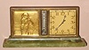 Swiss, Partner's Desk clock (dial on each side), with a calendar on one side and a gilt bronze relief of a sailor in rain gear (she looks female to us), and a thermometer on both sides, the base of green onyx, jeweled movement stem wound from bottom. C.1930