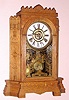 Wm. L. Gilbert Clock Co., "ALTAI", 8-day time and cathedral gong strike, bell alarm mantel clock. This is a later version with some design changes produced in Oak. Circa 1895.