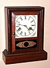 Wm. L. Gilbert Clock Co., "Coupon", 30-hour time/strike cottage clock. Circa 1879.