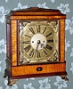 English, double fusee 8-day movement C.1850, now in a C.1975 home made case of tiger maple veneer over plywood.